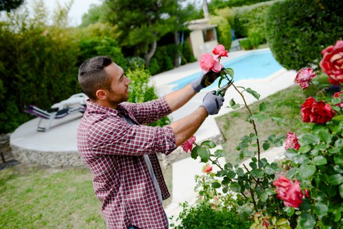 Team member preparing tools at a garden site